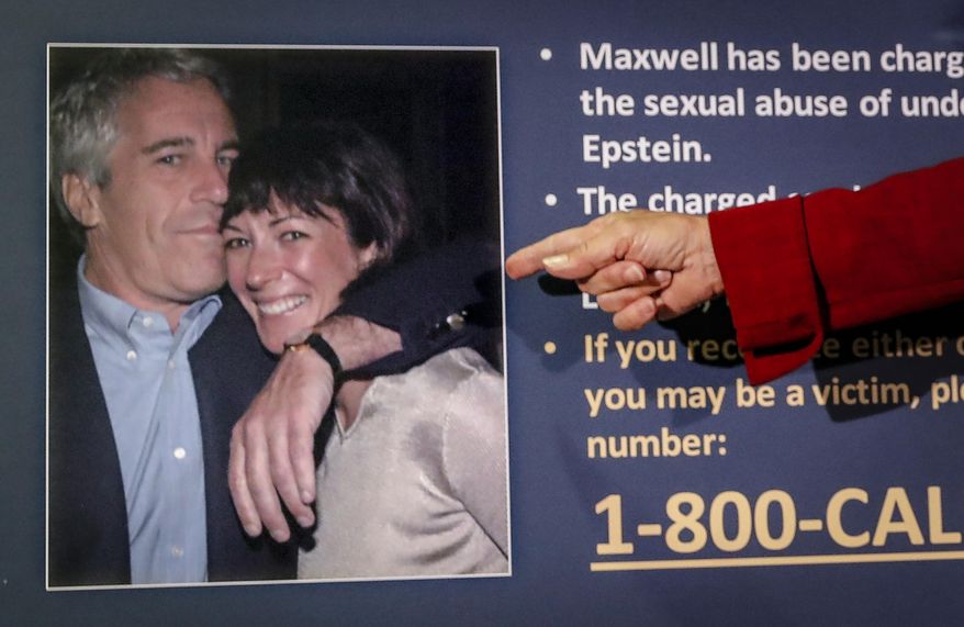 Audrey Strauss, acting U.S. attorney for the Southern District of New York, points to a photo of Jeffrey Epstein and Ghislaine Maxwell, during a news conference in New York on July 2, 2020. (AP Photo/John Minchillo) **FILE**