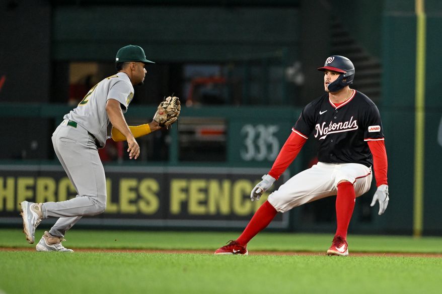 Washington Nationals third baseman Brady House (55) getting caught in a rundown and being chased down by Athletics shortstop Darell Hernaiz (2) after hitting an RBI single during the fourth inning of an MLB game at Nationals Park in Washington D.C., August 5, 2025. (Photo by All-Pro Reels for Washingto\n Times Sports)