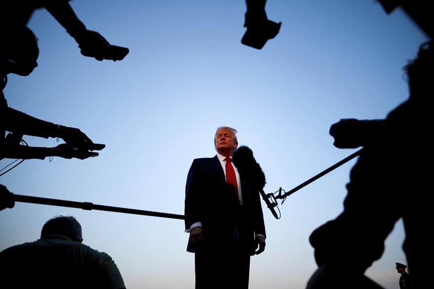 President Donald Trump speaks with reporters before boarding Air Force One at Lehigh Valley International Airport, in Allentown, Pa., Aug. 3, 2025. (AP Photo/Julia Demaree Nikhinson)