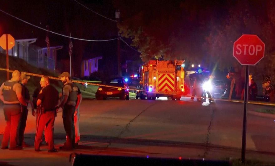 This image taken from video provided by WOWT shows a fire truck and other emergency and law enforcement vehicles in Glenwood, Iowa, Wednesday, Aug. 6, 2025. (WOWT via AP)