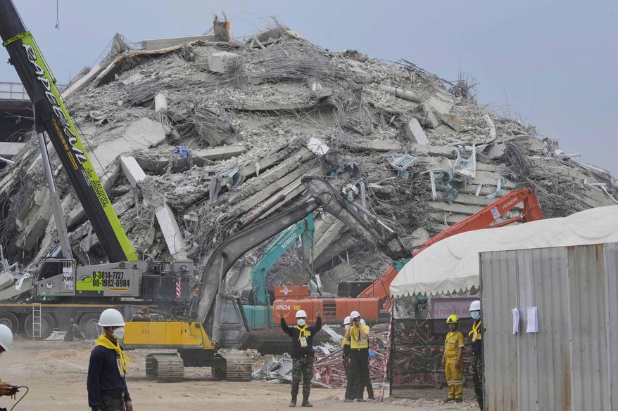 FILE - Rescuers work at the site of an under-construction high-rise building that collapsed after an earthquake in Bangkok, Thailand, Monday, March, 31, 2025. (AP Photo/Manish Swarup, File)