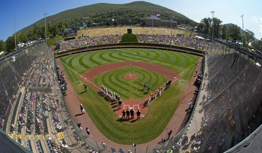Taiwan lines the third baseline as Lake Mary, Fla., lines the first baseline during team introductions before the Little League World Series Championship game at Lamade Stadium in South Williamsport, Pa., Sunday, Aug. 25, 2024. (AP Photo/Gene J. Puskar, File)