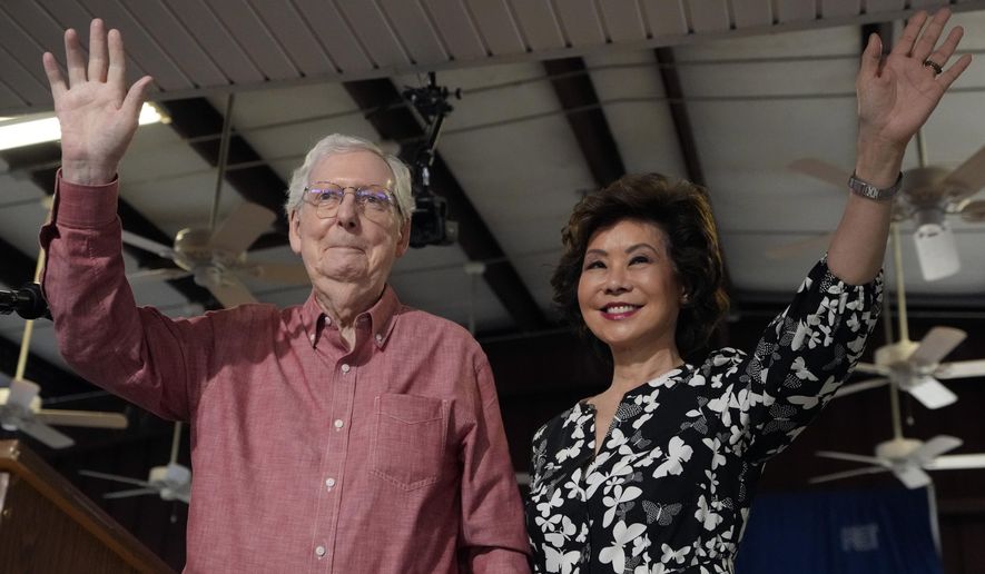 Sen. Mitch McConnell, R-Ky., left, and his wife, Elaine Chao, wave to the crowd at the annual Fancy Farm picnic Saturday, Aug. 2, 2025, in Fancy Farm, Ky. (AP Photo/Mark Humphrey)