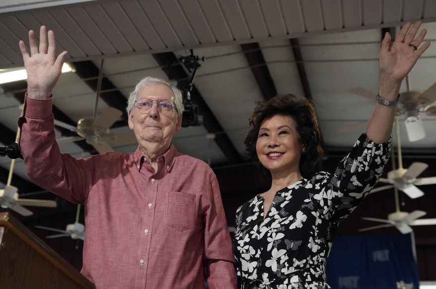 Sen. Mitch McConnell, R-Ky., left, and his wife, Elaine Chao, wave to the crowd at the annual Fancy Farm picnic Saturday, Aug. 2, 2025, in Fancy Farm, Ky. (AP Photo/Mark Humphrey)