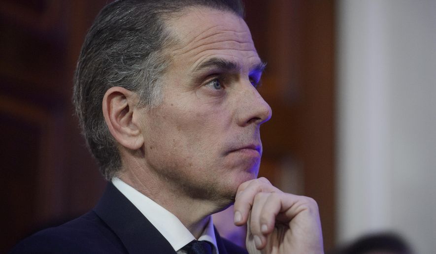 Hunter Biden listens while his father, President Joe Biden, speaks during a Hanukkah reception in the East Room of the White House in Washington, Dec. 16, 2024. (AP Photo/Rod Lamkey Jr.)
