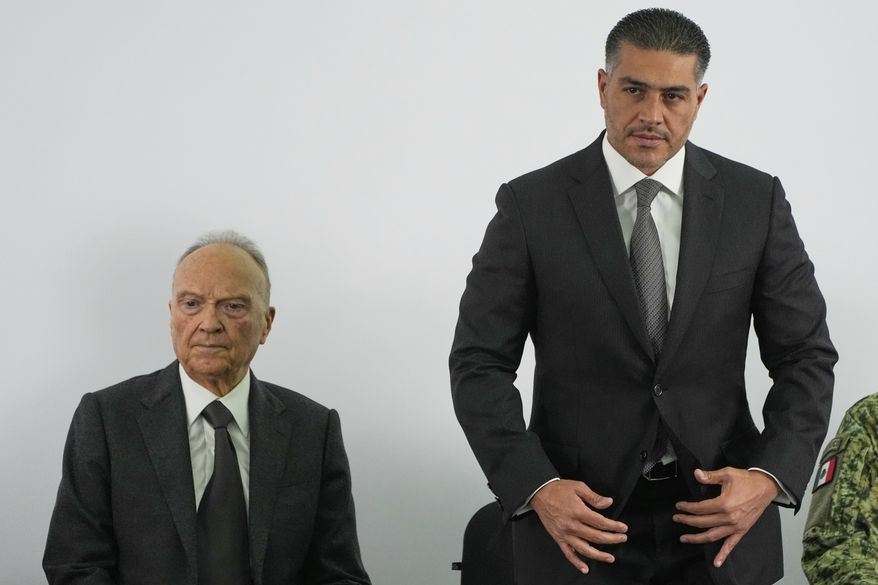 Mexican Security and Citizen Protection Minister Omar Garcia Harfuch, right, and Mexican General Prosecutor Alejandro Gertz Manero give a news conference about Mexico having sent 29 Mexican drug cartel figures to the U.S., in Mexico City, Wednesday, Aug. 13, 2025. (AP Photo/Fernando Llano)