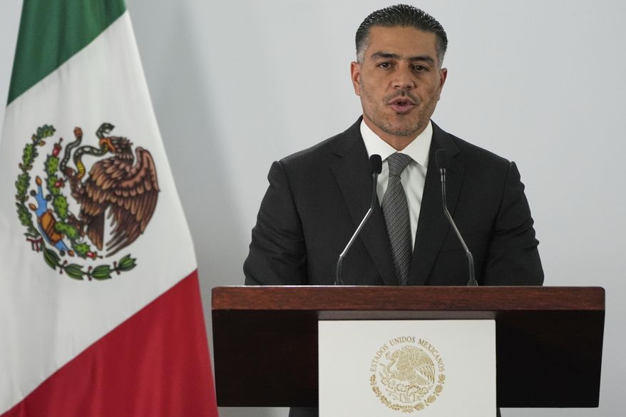 Mexican Security and Citizen Protection Minister Omar Garcia Harfuch gives a news conference about Mexico having sent 29 Mexican drug cartel figures to the U.S., in Mexico City, Wednesday, Aug. 13, 2025. (AP Photo/Fernando Llano)