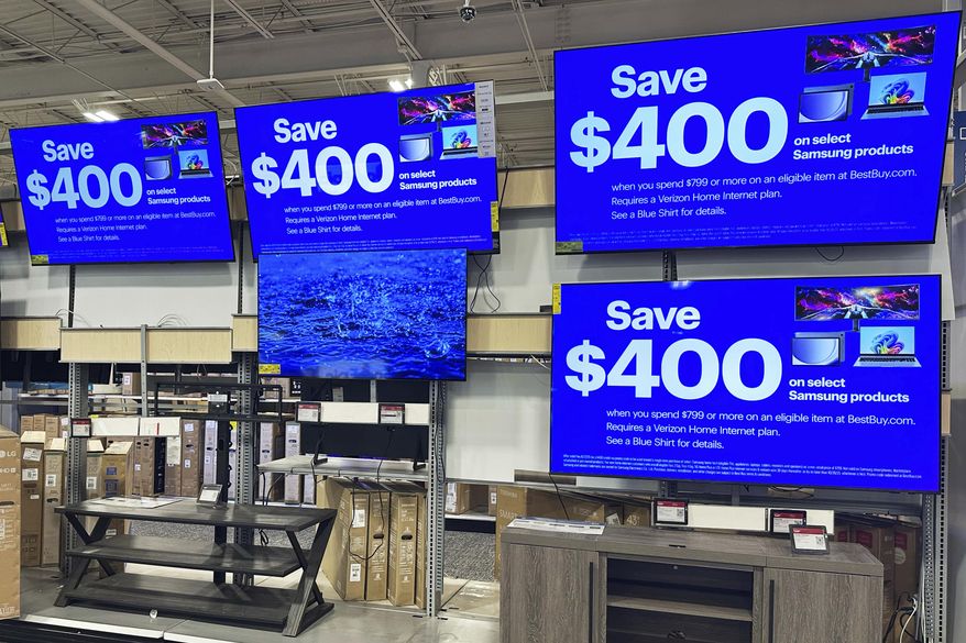Flat screen TVs are displayed at a retail store in Vernon Hills, Ill., Thursday, Aug. 7, 2025. (AP Photo/Nam Y. Huh)