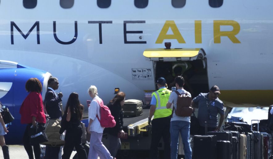 Texas Democratic lawmakers return to Texas after leaving two weeks ago to block a vote on a redrawn redistricting map, Monday, Aug. 18, 2025, in Austin, Texas. (AP Photo/Eric Gay)