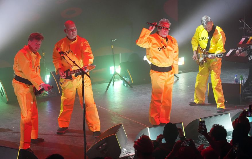 Gerald Casale, from left, Josh Hager, Mark Mothersbaugh and Bob Mothersbaugh of Devo perform on Jan. 22, 2024, in Park City, Utah. (AP Photo/Chris Pizzello, File)