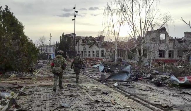 In this photo taken from video distributed by the Russian Defense Ministry Press Service on Thursday, March 13, 2025, Russian soldiers patrol an area in Sudzha, in the Kursk region of Russia, after it was taken over by Russian troops. (Russian Defense Ministry Press Service via AP, File)