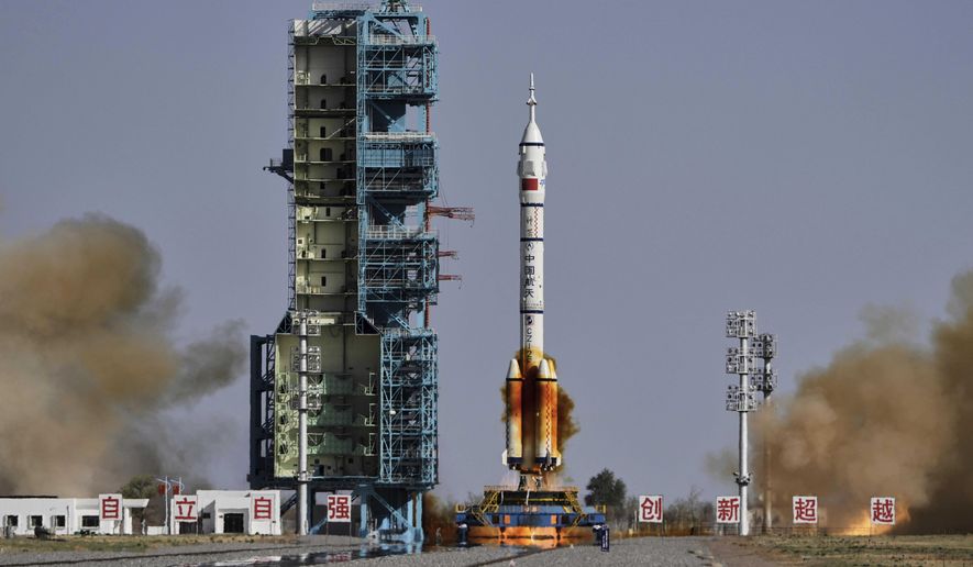 China's Long March 2F rocket, carrying three astronauts for the Shenzhou 20 manned space mission, blasts off at the Jiuquan Satellite Launch Center in Jiuquan, northwestern China, April 24, 2025. (AP Photo/Andy Wong, File)