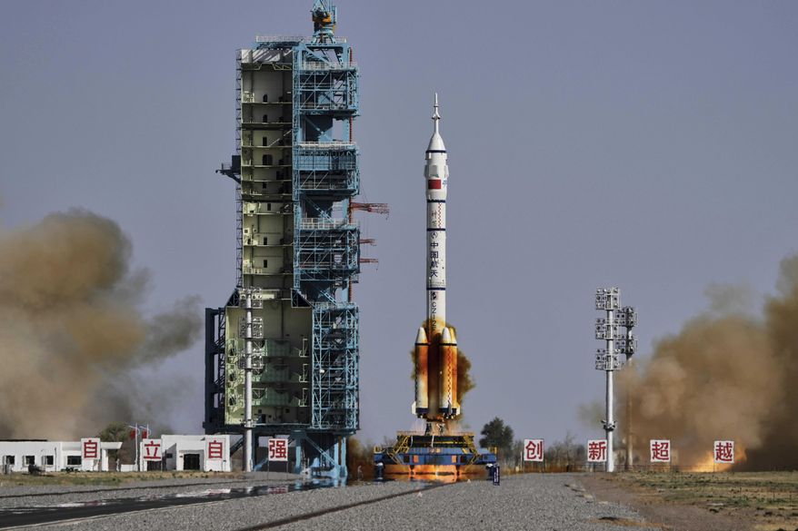 China's Long March 2F rocket, carrying three astronauts for the Shenzhou 20 manned space mission, blasts off at the Jiuquan Satellite Launch Center in Jiuquan, northwestern China, April 24, 2025. (AP Photo/Andy Wong, File)