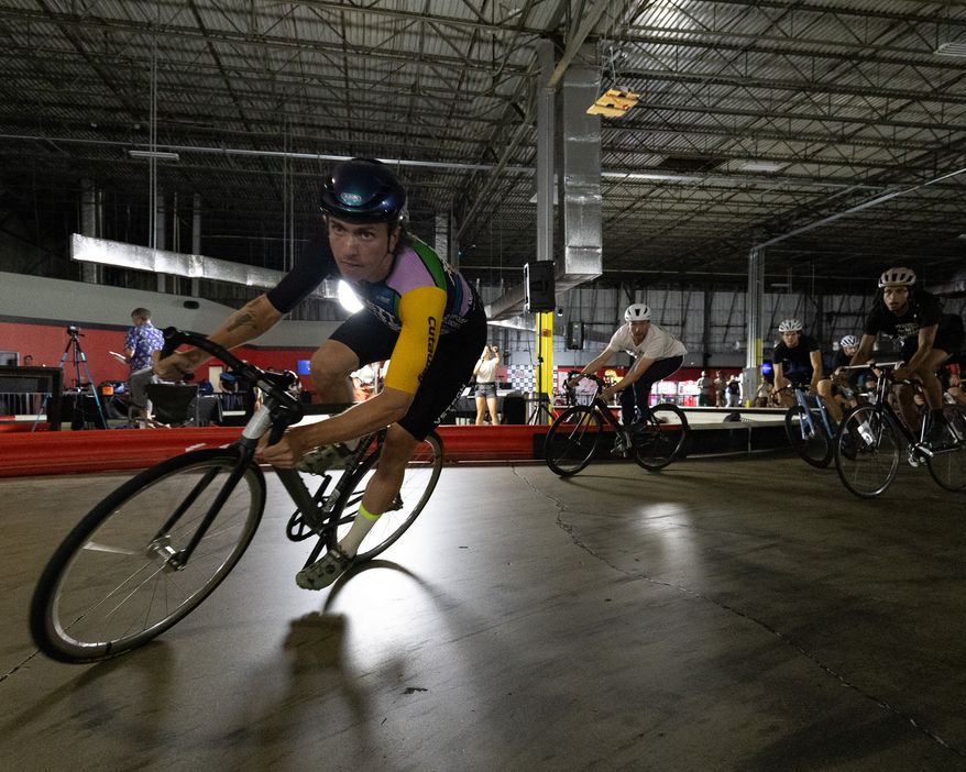 Fixed-gear cyclists round a corner at the K1 Speed racetrack in Jessup, Maryland, during a Formula Fixed qualifier. The upstart cycling league is looking to bring brakeless races to arenas throughout the country and take the niche sport into the modern era with an emphasis on social media. (Photo courtesy of Connor Driscoll/ Formula Fixed)