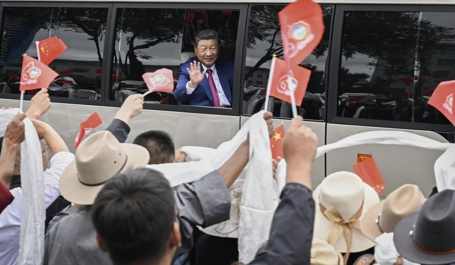 In this photo released by Xinhua News Agency, Chinese President Xi Jinping waves to people from a vehicle as he arrives at Lhasa in western China's Tibet Autonomous Region on Wednesday, Aug. 20, 2025, to attend an event to mark the 60th anniversary of the consolidation of Beijing's long-contested rule over the Himalayan territory. (Shen Hong/Xinhua via AP) **FILE**