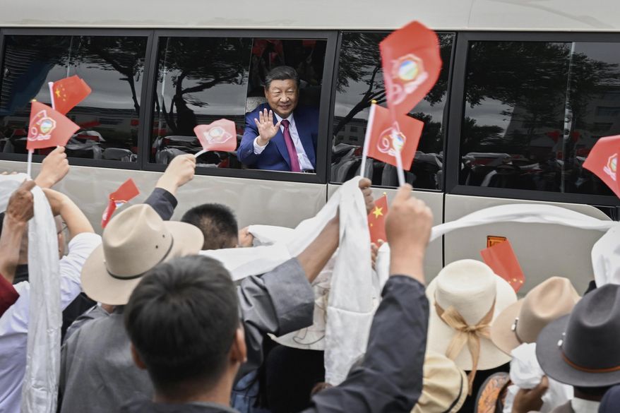 In this photo released by Xinhua News Agency, Chinese President Xi Jinping waves to people from a vehicle as he arrives at Lhasa in western China's Tibet Autonomous Region on Wednesday, Aug. 20, 2025, to attend an event to mark the 60th anniversary of the consolidation of Beijing's long-contested rule over the Himalayan territory. (Shen Hong/Xinhua via AP) **FILE**