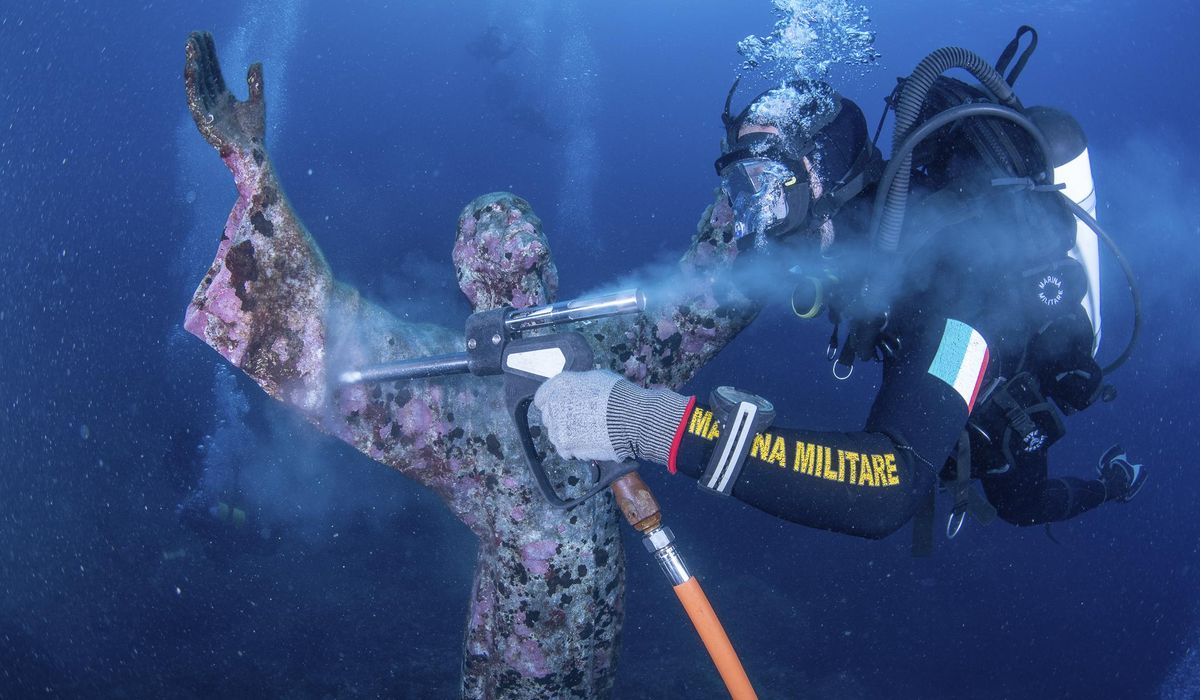 NextImg:Italian divers water-blast the popular underwater statue of Christ off Portofino