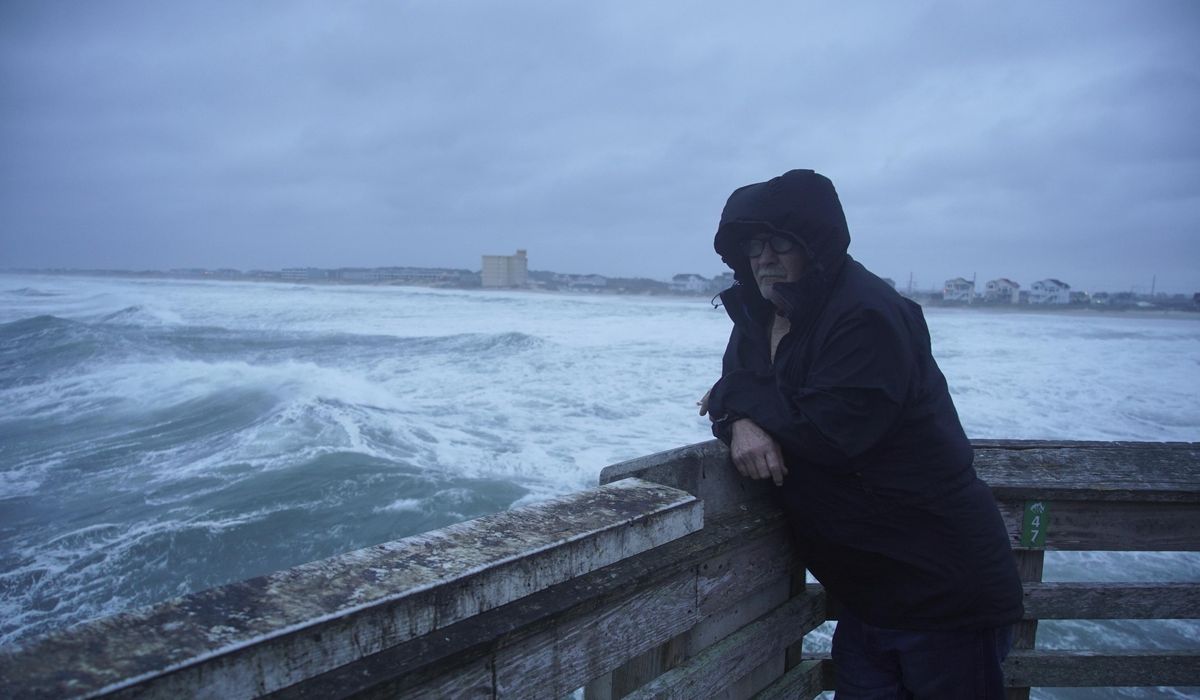 NextImg:Hurricane Erin stirs up strong winds and floods part of a N.C. highway as it slowly moves out to sea