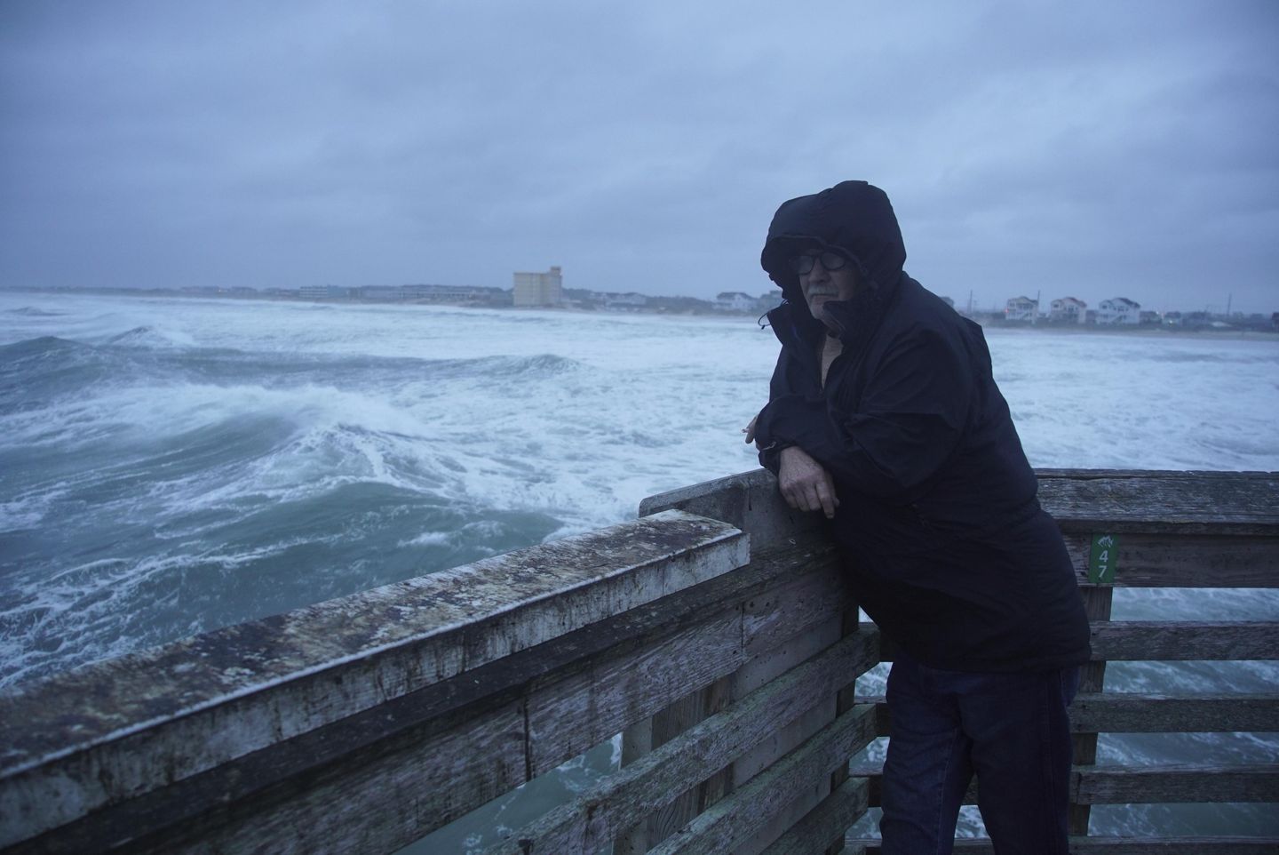 Hurricane Erin stirs up strong winds and floods part of a N.C. highway as it slowly moves out to sea