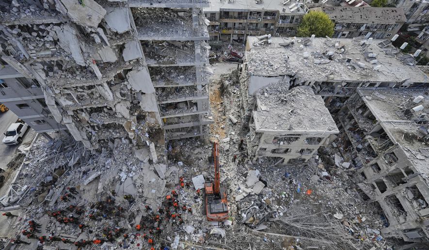 FILE -Israeli soldiers search through the rubble of residential buildings destroyed by an Iranian missile strike in Bat Yam, central Israel, June 15, 2025. (AP Photo/Baz Ratner, File)