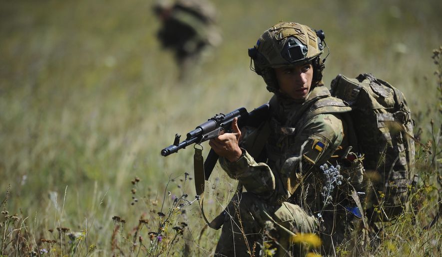 In this photo, taken on Tuesday, Aug. 19, 2025 and provided by Ukraine's 127th Separate Brigade of the Territorial Defence press service, soldiers aged 18 to 24 practice military skills on a training ground near Kharkiv, Ukraine. (Anatolii Lysianskyi/Ukraine's 127th Separate Brigade via AP)