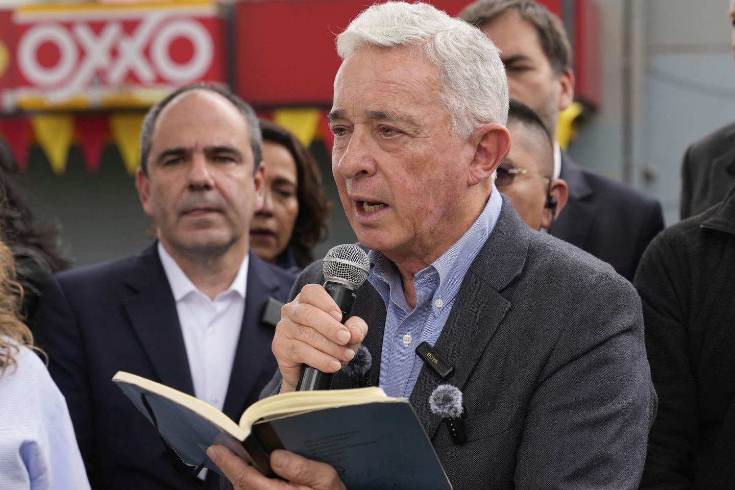 Colombian ex-leader known for contentious war on rebels pays tribute to slain presidential hopeful