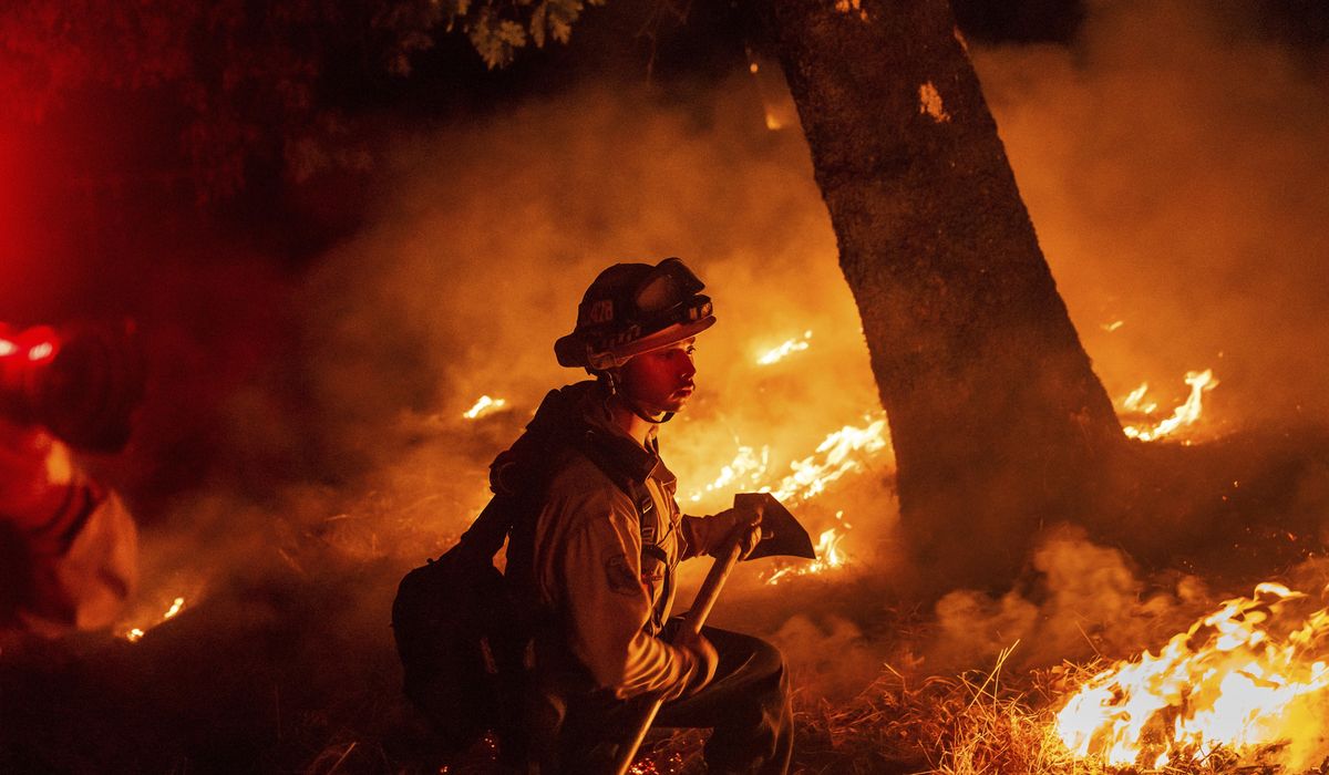 NextImg:Wildfires expand in Oregon and California, threatening homes and prompting evacuations