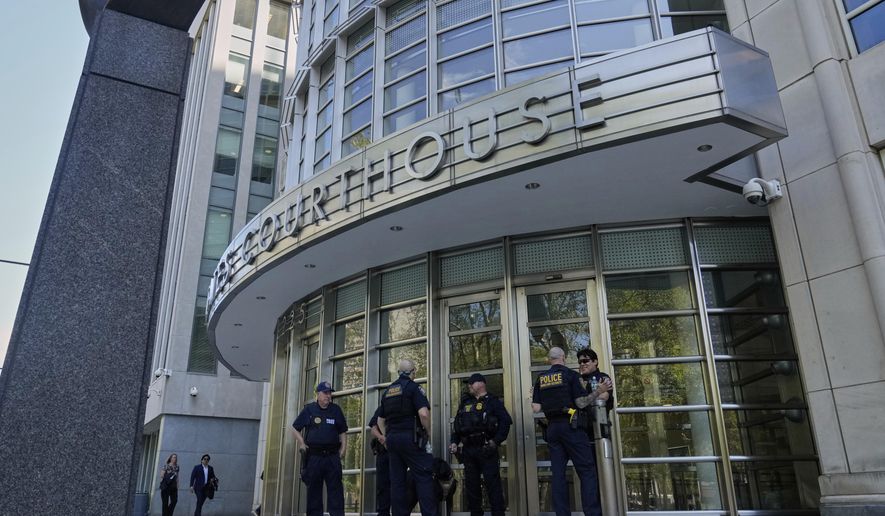 A group of Department of Homeland Security Police stand outside Federal court in the Brooklyn borough of New York, Monday, Aug. 25, 2025. (AP Photo/Richard Drew)