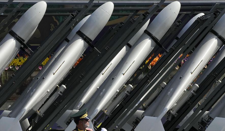 Iranian-made drones of the Revolutionary Guard aerospace division are seen on a truck during an annual military parade in front of the shrine of the late revolutionary founder Ayatollah Khomeini, just outside Tehran, Iran, Sept. 22, 2023. (AP Photo/Vahid Salemi, File)