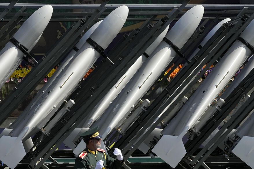 Iranian-made drones of the Revolutionary Guard aerospace division are seen on a truck during an annual military parade in front of the shrine of the late revolutionary founder Ayatollah Khomeini, just outside Tehran, Iran, Sept. 22, 2023. (AP Photo/Vahid Salemi, File)