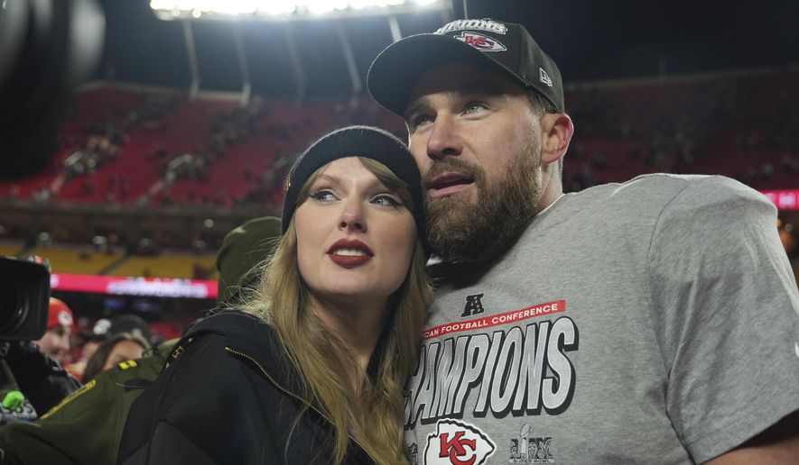 Kansas City Chiefs tight end Travis Kelce, right, is congratulated by Taylor Swift as they celebrate the Chiefs victory over the Buffalo Bills in the AFC Championship NFL football game, Jan. 26, 2025, in Kansas City, Mo. (AP Photo/Charlie Riedel, File)