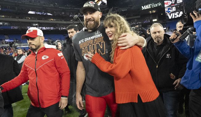 Kansas City Chiefs tight end Travis Kelce and Taylor Swift walk together after an AFC Championship NFL football game between the Chiefs and the Baltimore Ravens, Jan. 28, 2024, in Baltimore. (AP Photo/Julio Cortez, File)
