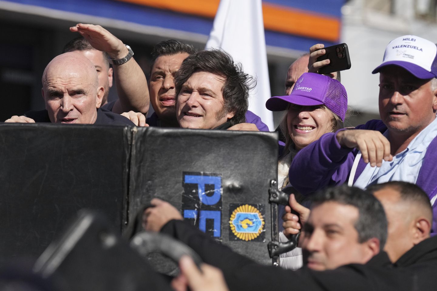 Protesters throw rocks at Argentine President Milei's convoy while he campaigns