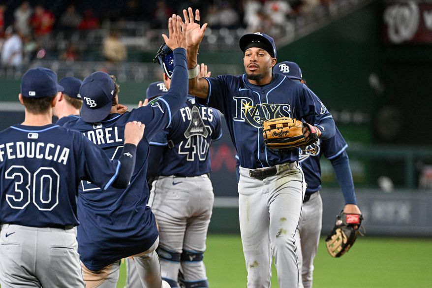Tampa Bay Rays left fielder Chandler Simpson (14) slapping hands of teammates after the team’s 4-1 victory over the Washington Nationals at Nationals Park in Washington D.C., August 29, 2025. (Photo by All-Pro Reels for Washington Times Sports)