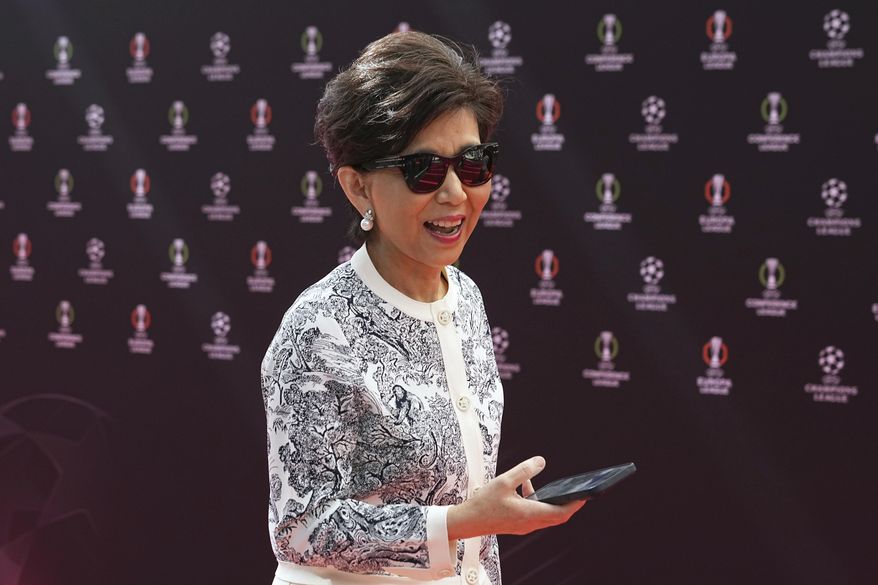 American businesswoman Michele Kang, owner of Olympique Lyonnais, arrives for the Europa League soccer league phase draw in Monaco, Friday, Aug. 29, 2025. (AP Photo/Laurent Cipriani)