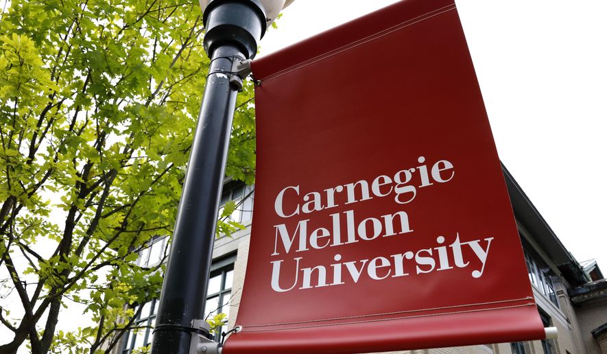 A Carnegie Mellon University sign is displayed outside Baker Hall on the university's campus in Pittsburgh, June 7, 2019. (AP Photo/Gene J. Puskar, File)