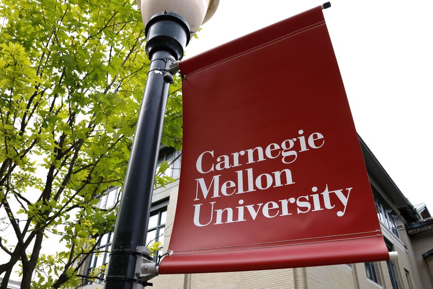 A Carnegie Mellon University sign is displayed outside Baker Hall on the university's campus in Pittsburgh, June 7, 2019. (AP Photo/Gene J. Puskar, File)