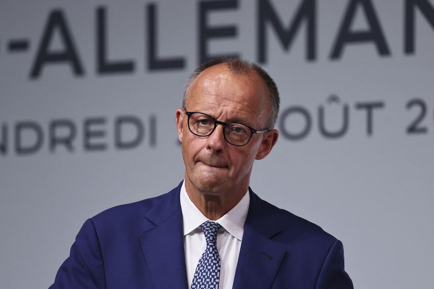 German Chancellor Friedrich Merz attends a joint news conference with French President Emmanuel Macron after a Franco-German cabinet meeting and a meeting of the Franco-German Defense and Security Council (CFADS) in Toulon, southern France, Friday Aug. 29, 2025. (Manon Cruz/Pool via AP)