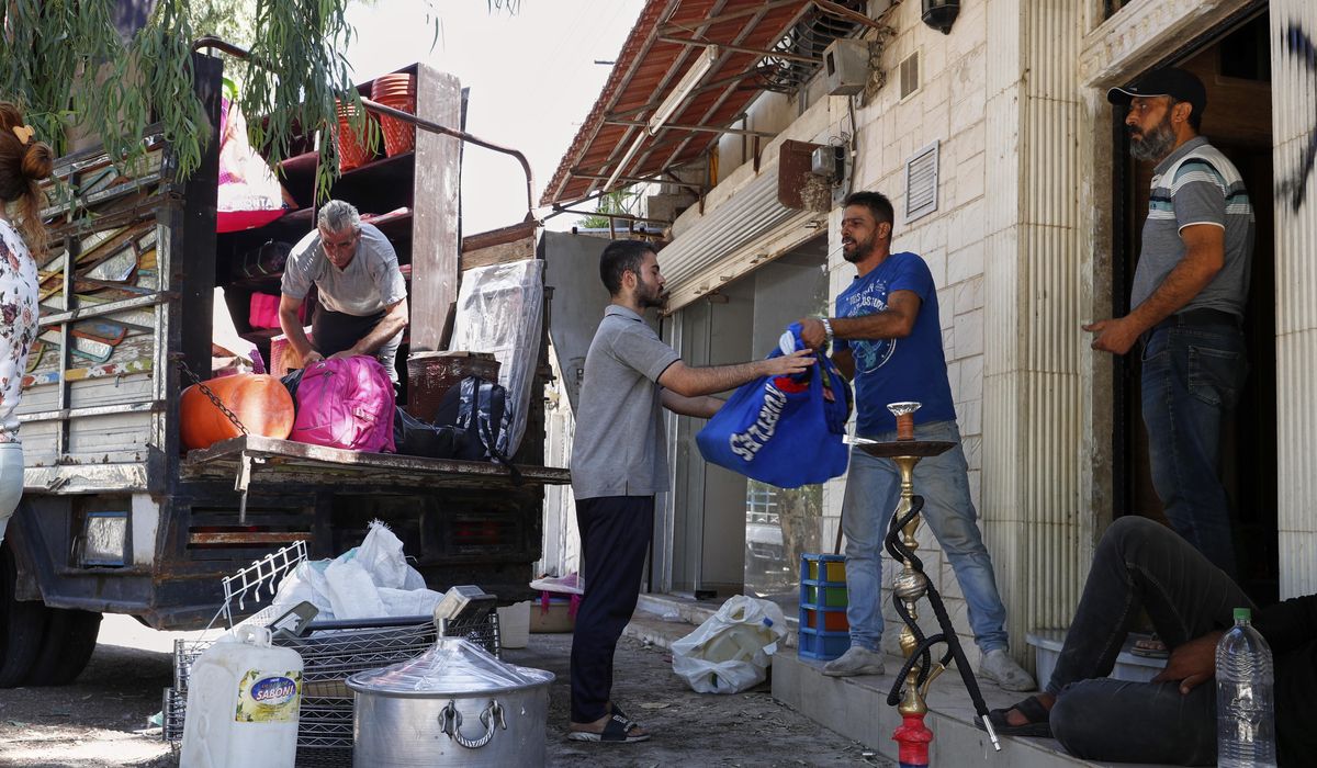 NextImg:Alawite families flee Damascus suburb after violence and eviction threats