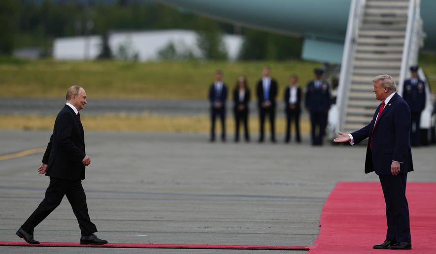 U.S. President Donald Trump greets Russia's President Vladimir Puti at Joint Base Elmendorf-Richardson, Alaska, Aug. 15, 2025. (AP Photo/Julia Demaree Nikhinson)
