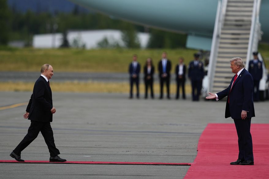 U.S. President Donald Trump greets Russia's President Vladimir Puti at Joint Base Elmendorf-Richardson, Alaska, Aug. 15, 2025. (AP Photo/Julia Demaree Nikhinson)