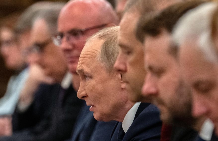 Russian President Vladimir Putin, center, speaks at the beginning of a bilateral meeting with Chinese President Xi Jinping, not seen, at The Great Hall of the People in Beijing, Tuesday, Sept. 2, 2025. (Pool Photo via AP)