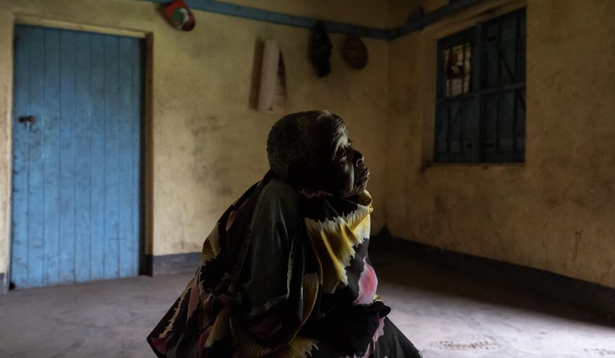 Ayder Kanyomushana, 81, who feels ostracized since she was accused of witchcraft by neighbors, sits at her home in Nyakitabire, a rural village in western Uganda, Monday, Nov. 18, 2024. (AP Photo/David Goldman)