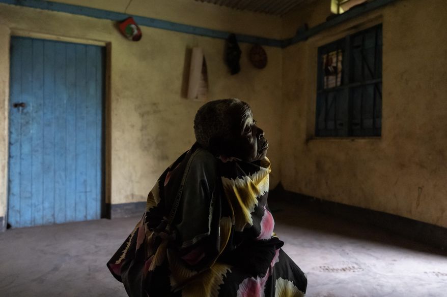 Ayder Kanyomushana, 81, who feels ostracized since she was accused of witchcraft by neighbors, sits at her home in Nyakitabire, a rural village in western Uganda, Monday, Nov. 18, 2024. (AP Photo/David Goldman)