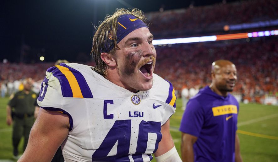 LSU linebacker Whit Weeks (40) reacts after defeating Clemson in an NCAA college football game Saturday, Aug. 30, 2025, in Clemson, S.C. (AP Photo/Jacob Kupferman) ** FILE **