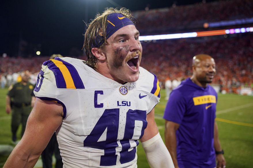 LSU linebacker Whit Weeks (40) reacts after defeating Clemson in an NCAA college football game Saturday, Aug. 30, 2025, in Clemson, S.C. (AP Photo/Jacob Kupferman) ** FILE **