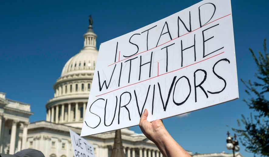 Protesters rally at a news conference calling for Congress to release all of the Jeffrey Epstein files, outside the U.S. Capitol, Wednesday, Sept. 3, 2025 in Washington. (AP Photo/Kevin Wolf)