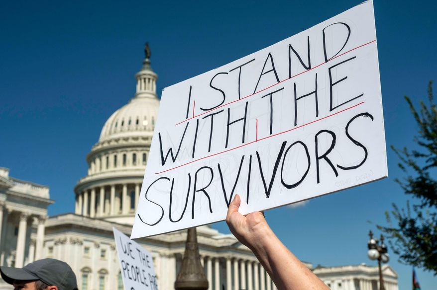 Protesters rally at a news conference calling for Congress to release all of the Jeffrey Epstein files, outside the U.S. Capitol, Wednesday, Sept. 3, 2025 in Washington. (AP Photo/Kevin Wolf)