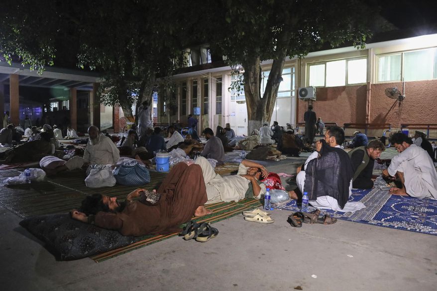 Afghans affected by a powerful earthquake that struck eastern Afghanistan on Sunday rest outside Nangarhar Regional Hospital in Jalalabad, Afghanistan, Wednesday, Sept. 3, 2025. (AP Photo/Siddiqullah Alizai)