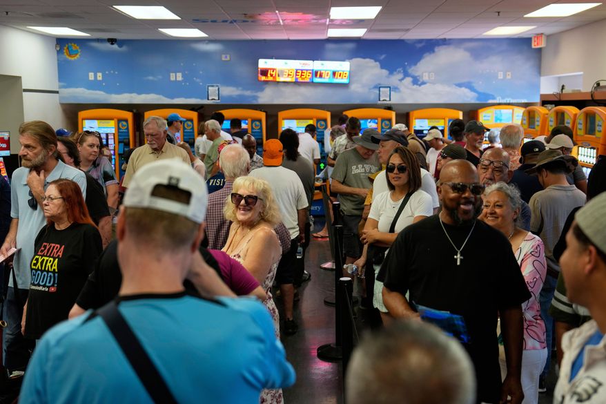 People wait in line to buy lottery tickets at the Lotto Store just inside the California border, Wednesday, Sept. 3, 2025, near Primm, Nev. (AP Photo/John Locher)